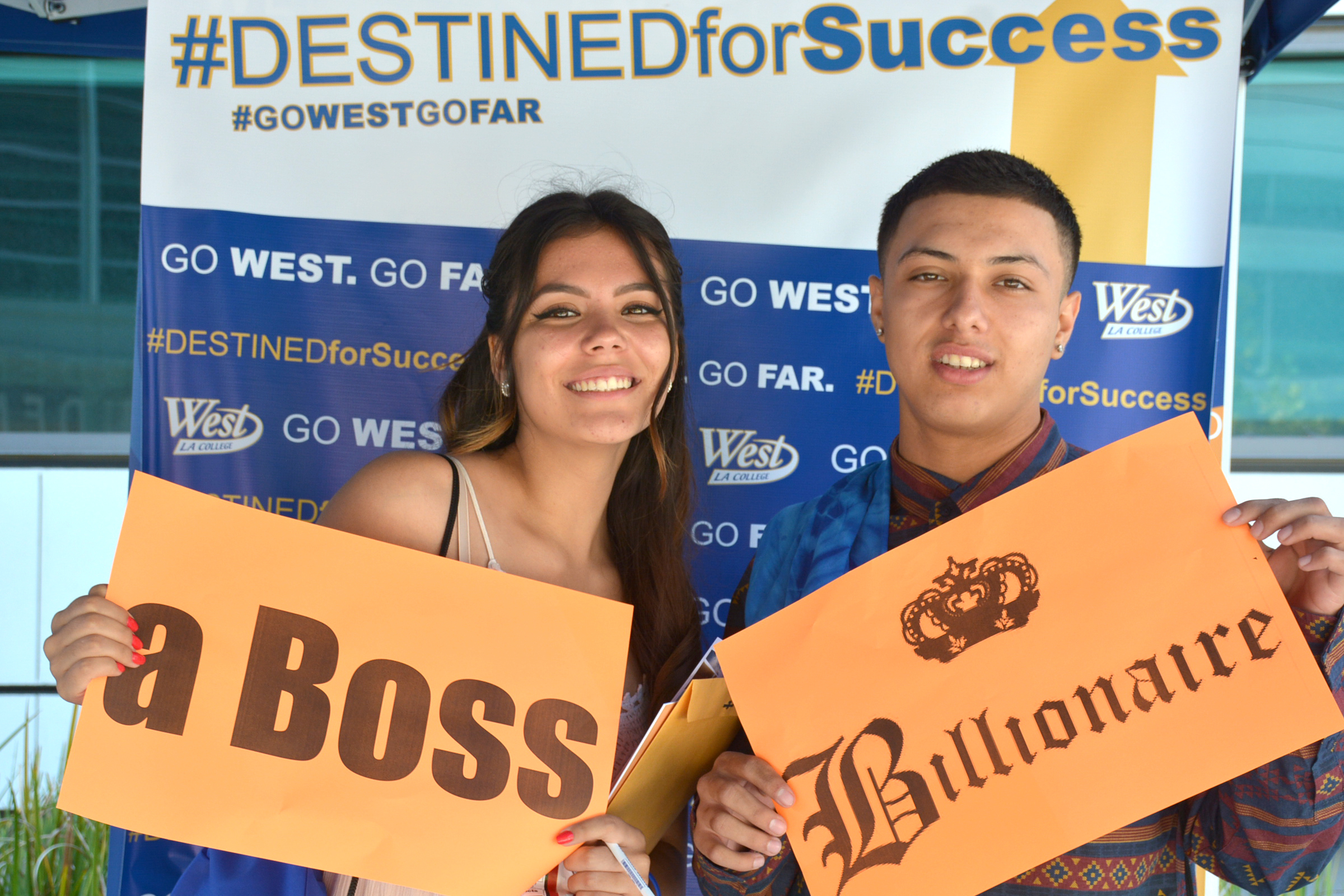 high school students in front of "Destined for Success" banner