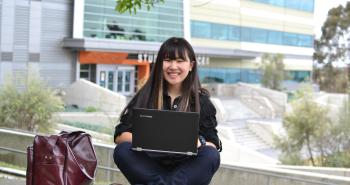 Women smiling at computer