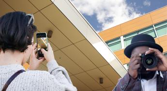 student taking photos on campus