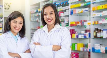 two pharmacy technicians in a pharmacy