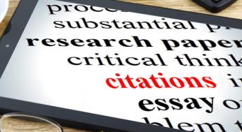 words on a tablet including "research, citations, essay"