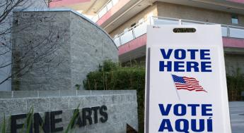 vote sign in front of Fine Arts Building