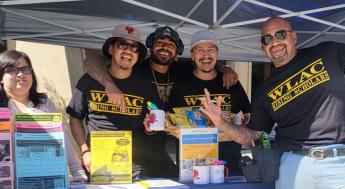 Rising Scholar students at information table