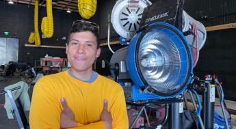 Film TV Production Student standing near film lights