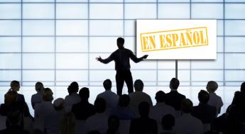 people watching a speaker at a confernce