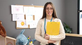 young teacher in elementary school classroom