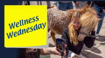 student taking selfie with mini horse