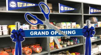 scissors cutting a "Grand Opening" ribbon