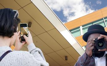 student taking photos on campus