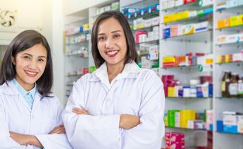 two pharmacy technicians in a pharmacy