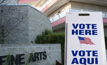 vote sign in front of Fine Arts Building