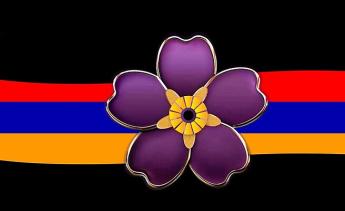 Purple flower on ribbon with color of Armenian flag