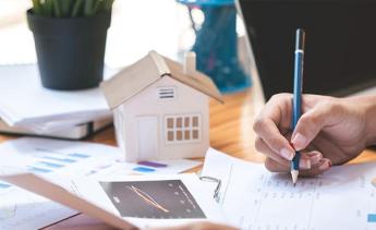 person completing real estate appraisal paperwork