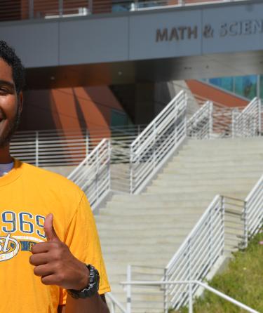 Student in Front of Math Building