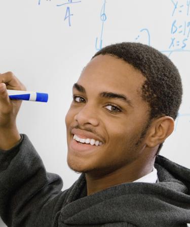 Student Writing on the Blackboard