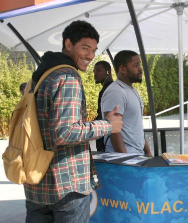 Student Gives Thumbs Up While Smiling