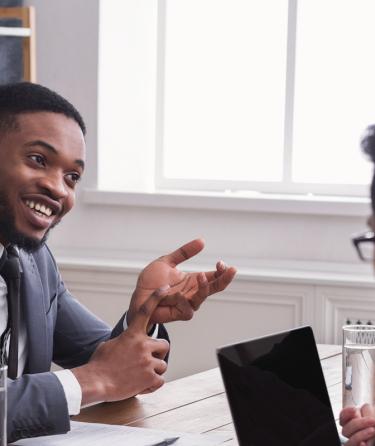 man being interviewed in business office