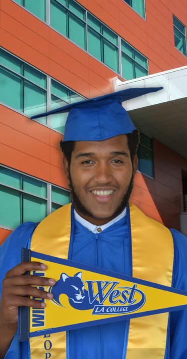 Graduate in front of MSA bld with $0 Tuition bubble