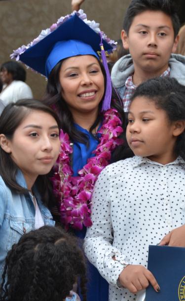 Student at Graduation with Family