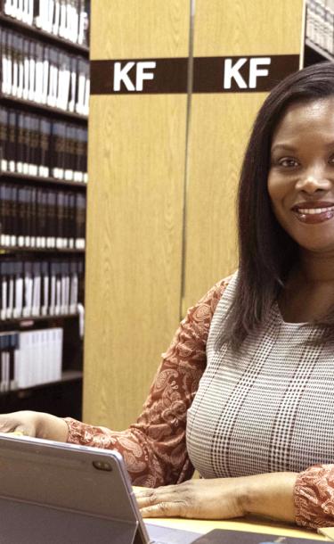 paralegal sitting with computer