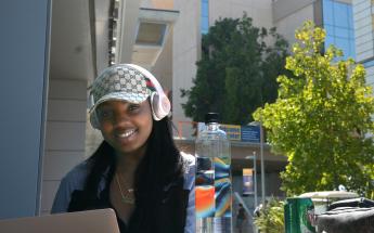 Female Student with Headphones