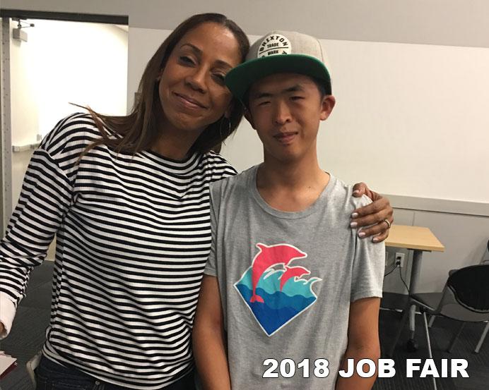 Two Students Hugging at Job Fair