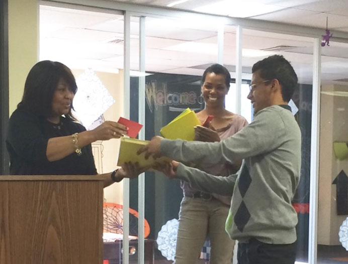 Staff with Student and Books