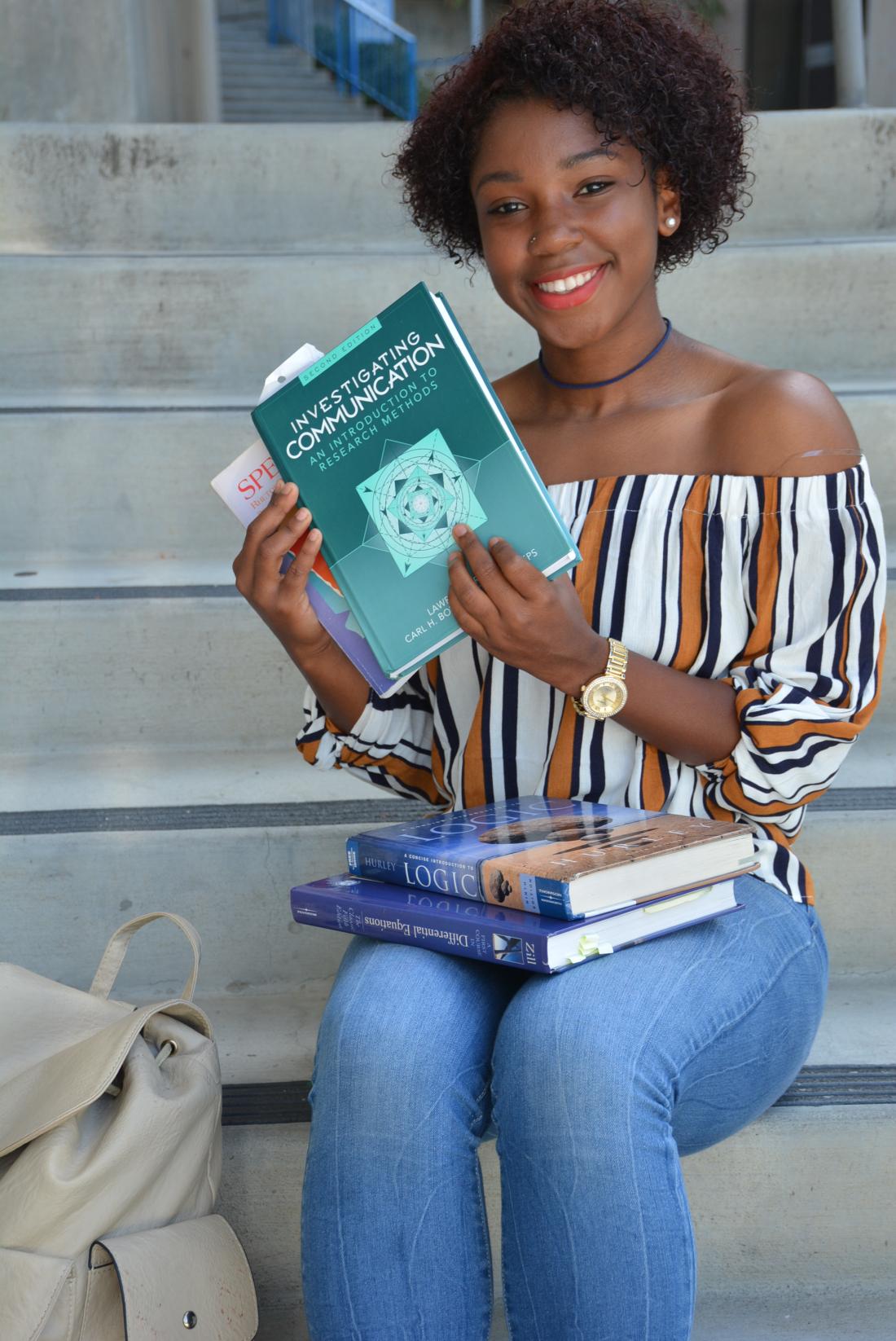 Student Smiling with books