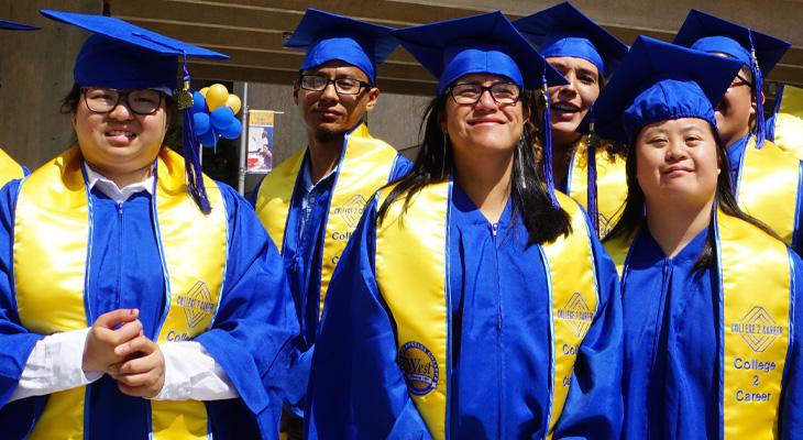 C2C students in graduation robes