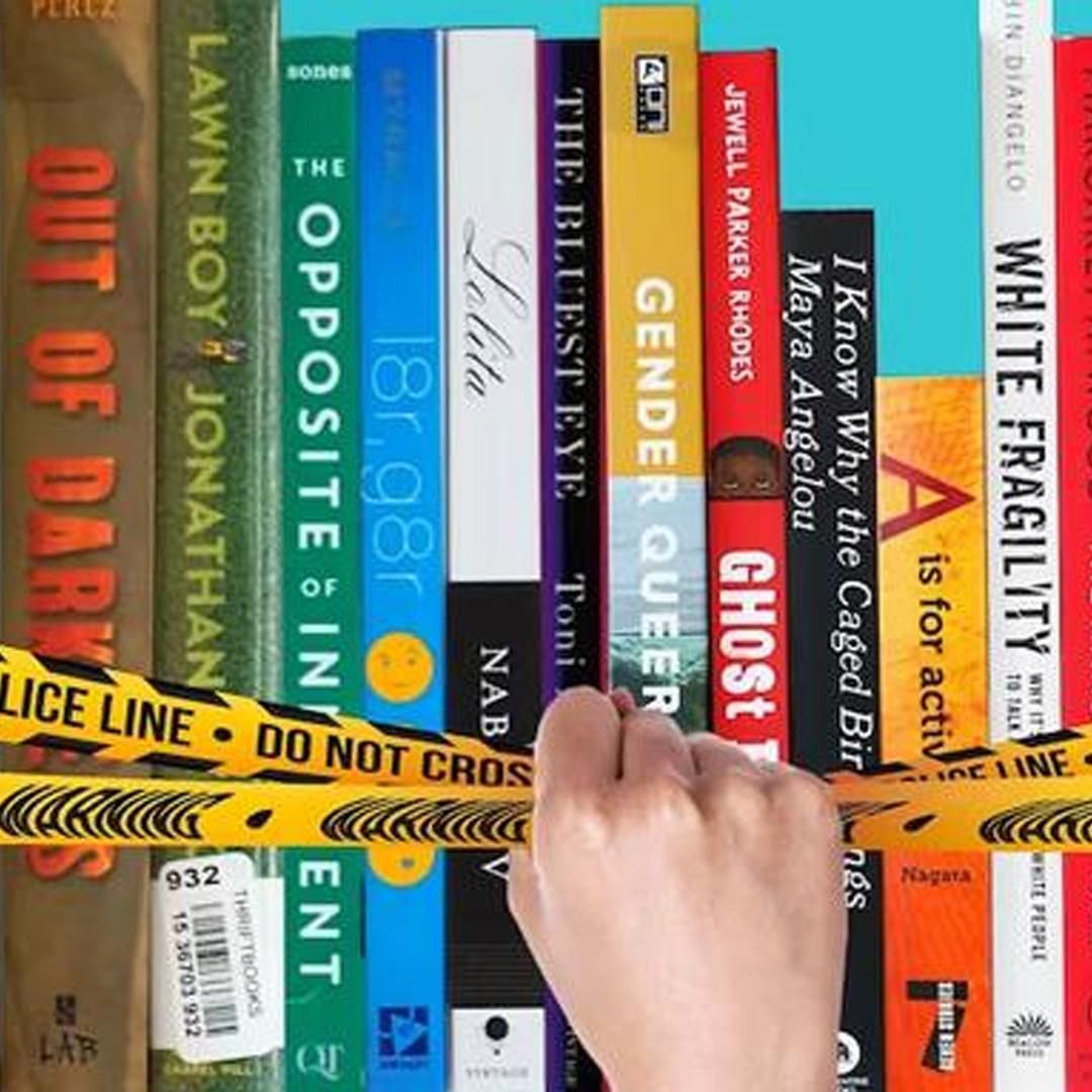 hand removing police tape from bookshelf