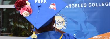 decorated graduation cap with words "debt-free"